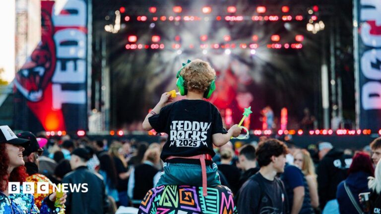 Dorset’s Teddy Rocks Festival raises £1m for children with cancer A crowd at Teddy Rocks festival in front of their stage. A child is seen on the shoulders of an adult in the middle of the crowd. The child is wearing a black shift reading Teddy Rocks 2025.