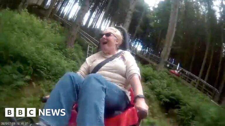A woman looking excited on a woodland rollercoaster