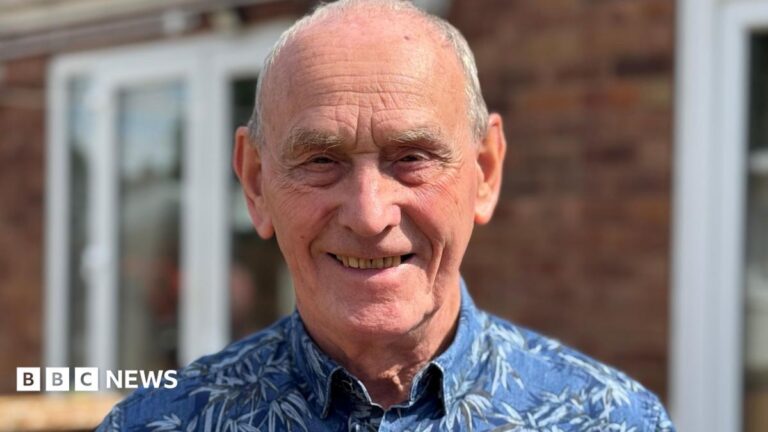 The simple Birmingham home test that could be ‘amazing’ for bladder cancer patients Trevor is standing in his back garden, smiling into camera. He is wearing a blue patterned shirt.