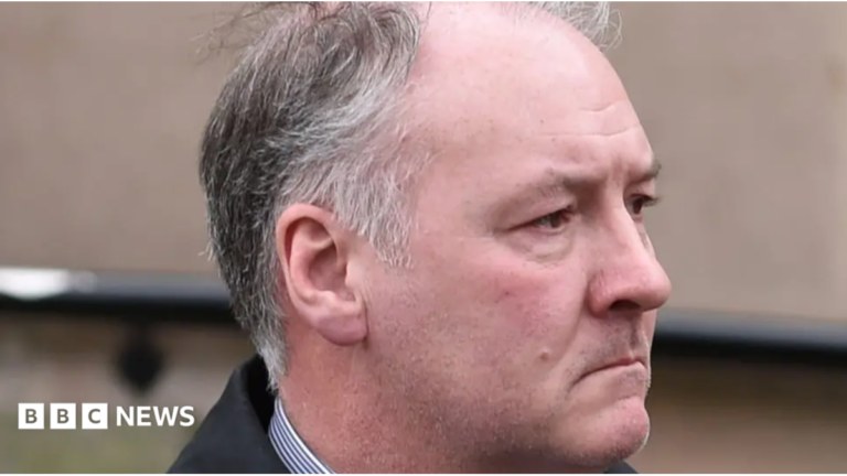 Coroner asks families linked to jailed surgeon to make contact A man with grey hair and a shirt looking to the right
