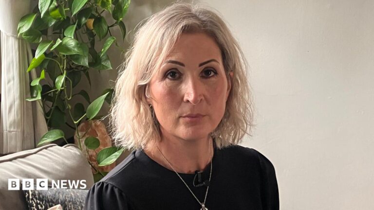 Myeloma blood cancer patients call for better drug access Louise Martinez wearing a black top with a necklace, sat on a sofa